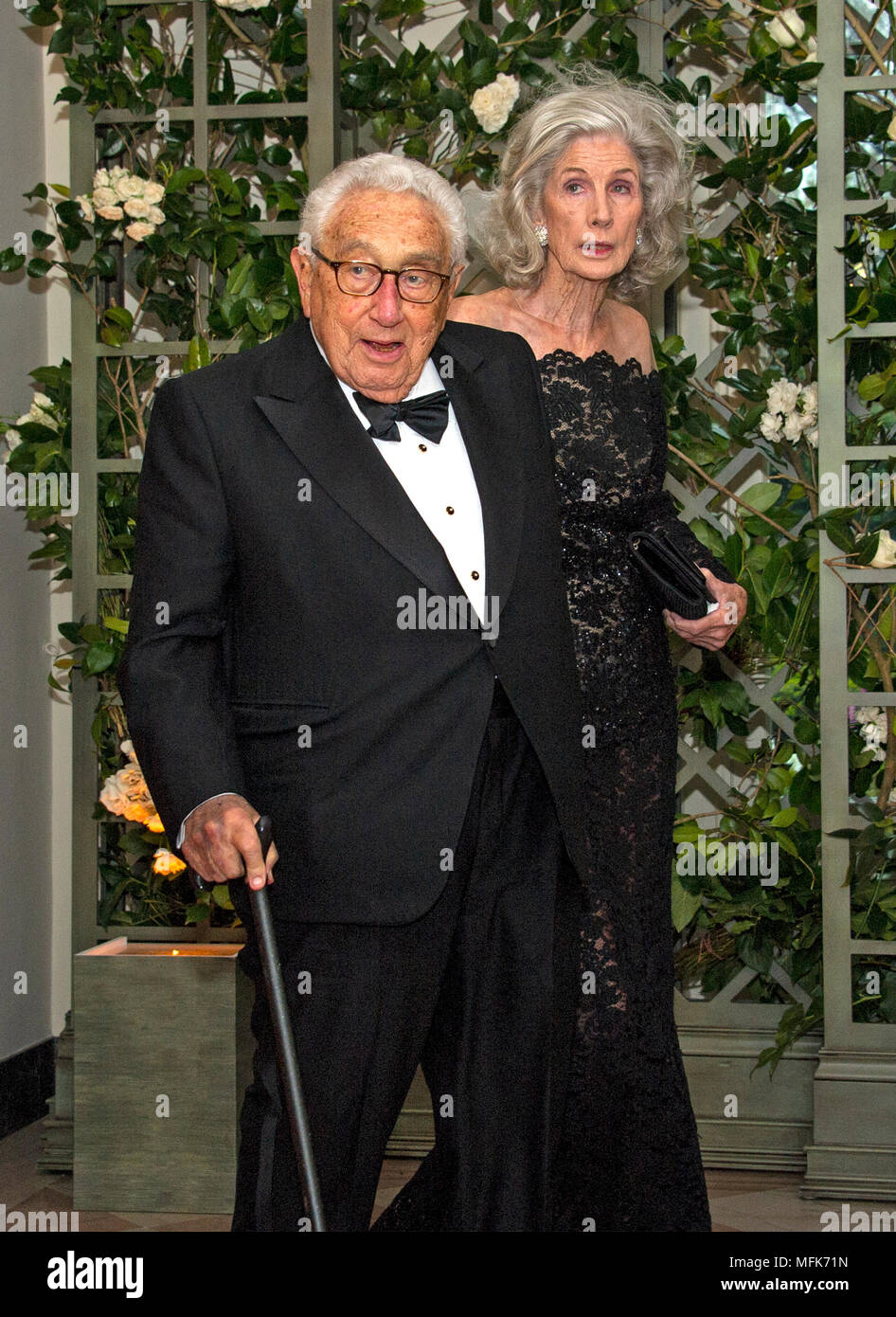 Washington, USA. 24th Apr, 2018. Former United States Secretary of State Henry A. Kissinger and Nancy Kissinger arrive for the State Dinner honoring Dinner honoring President Emmanuel Macron of the French Republic and Mrs. Brigitte Macron at the White House in Washington, DC on Tuesday, April 24, 2018. Credit: Ron Sachs/CNP - NO WIRE SERVICE - Credit: Ron Sachs/Consolidated News Photos/Ron Sachs - CNP/dpa/Alamy Live News Stock Photo