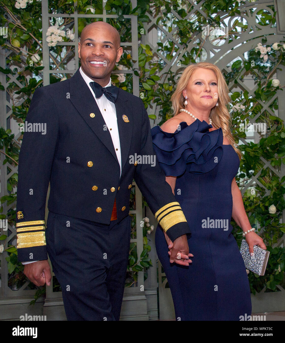Washington, USA. 24th Apr, 2018. United States Surgeon General Jerome Adams and Mrs. Lacey Adams arrive for the State Dinner honoring Dinner honoring President Emmanuel Macron of the French Republic and Mrs. Brigitte Macron at the White House in Washington, DC on Tuesday, April 24, 2018. Credit: Ron Sachs/CNP - NO WIRE SERVICE - Credit: Ron Sachs/Consolidated News Photos/Ron Sachs - CNP/dpa/Alamy Live News Stock Photo