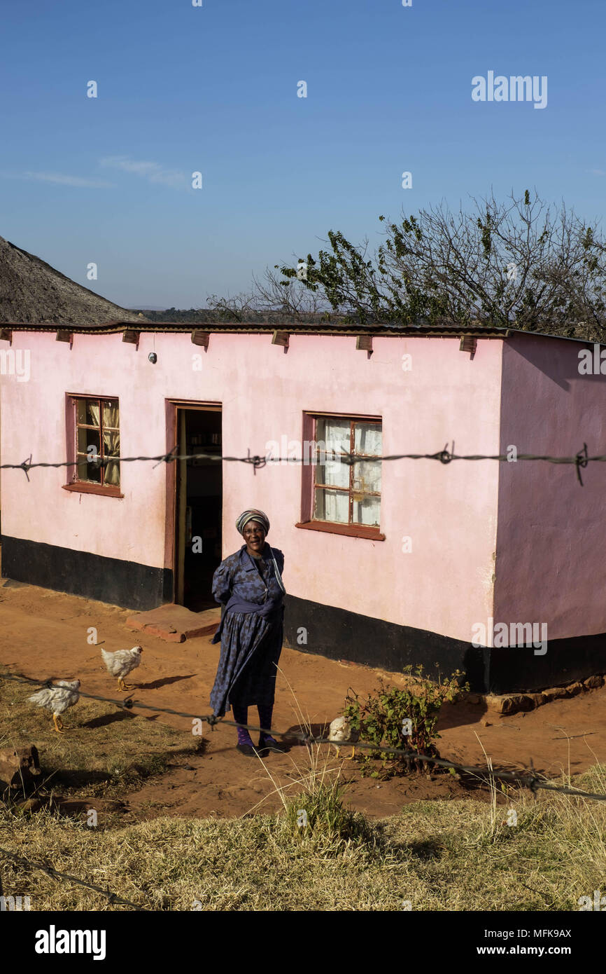 June 9, 2016 - Matatiele, Eastern Cape, South Africa - A XHosa women stands in fornt of her pink coloured house and is dressed in traditional clothes. (Credit Image: © Stefan Kleinowitz via ZUMA Wire) Stock Photo