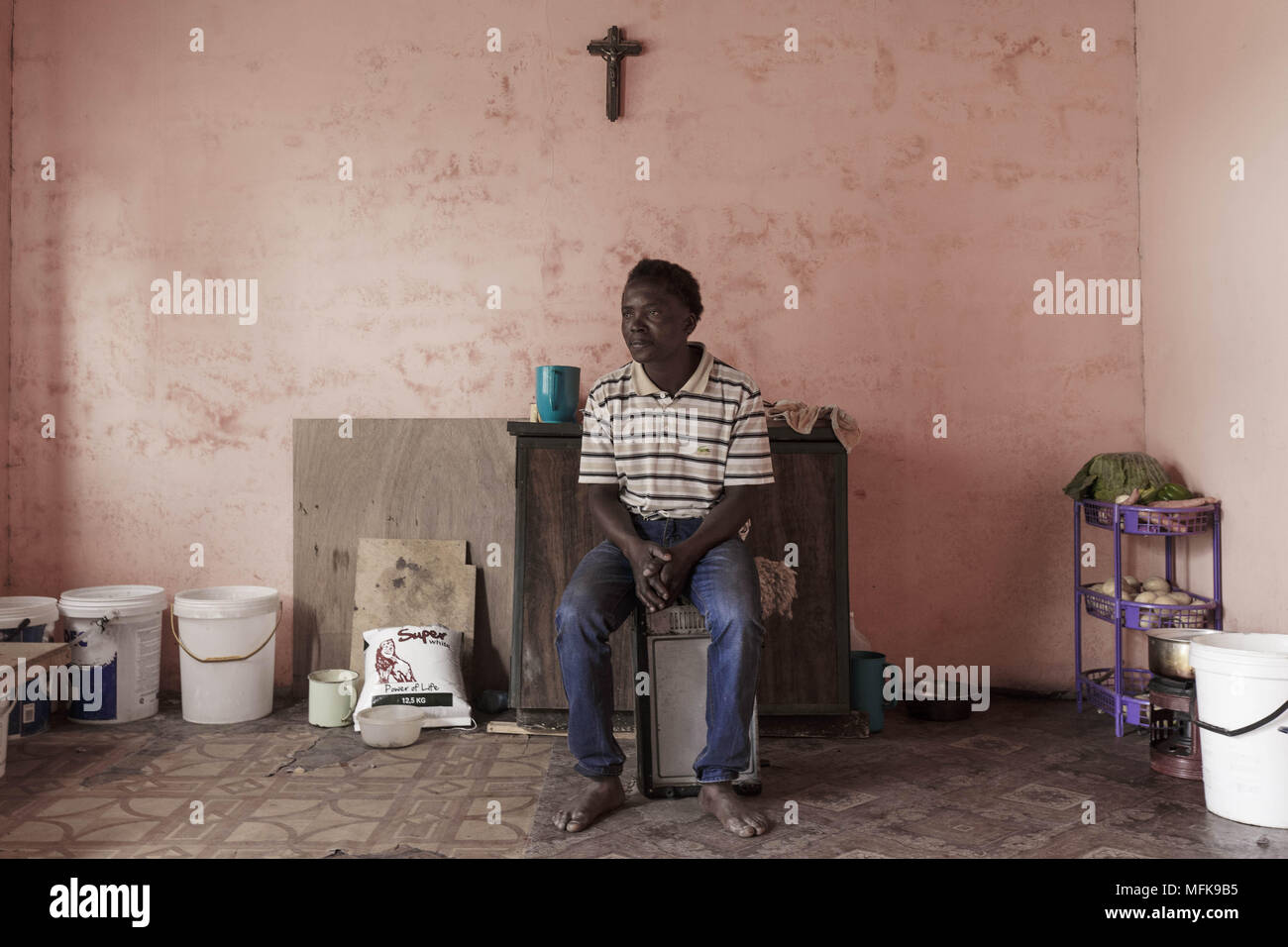 January 13, 2018 - Matatiele, Eastern Cape, South Africa - Kagiso, 35, sits in his mud house, which serves as a kitchen and a sleeping room for him and his two brothers. (Credit Image: © Stefan Kleinowitz via ZUMA Wire) Stock Photo