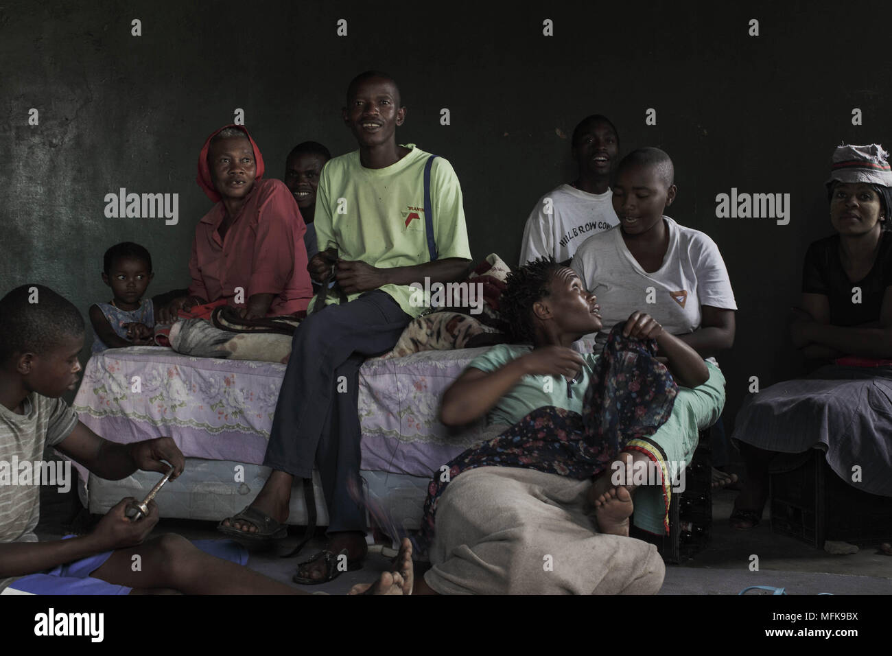 January 12, 2018 - Matatiele, Eastern Cape, South Africa - Family members, who live in the same household, sit together around a bed in the kitchen. (Credit Image: © Stefan Kleinowitz via ZUMA Wire) Stock Photo