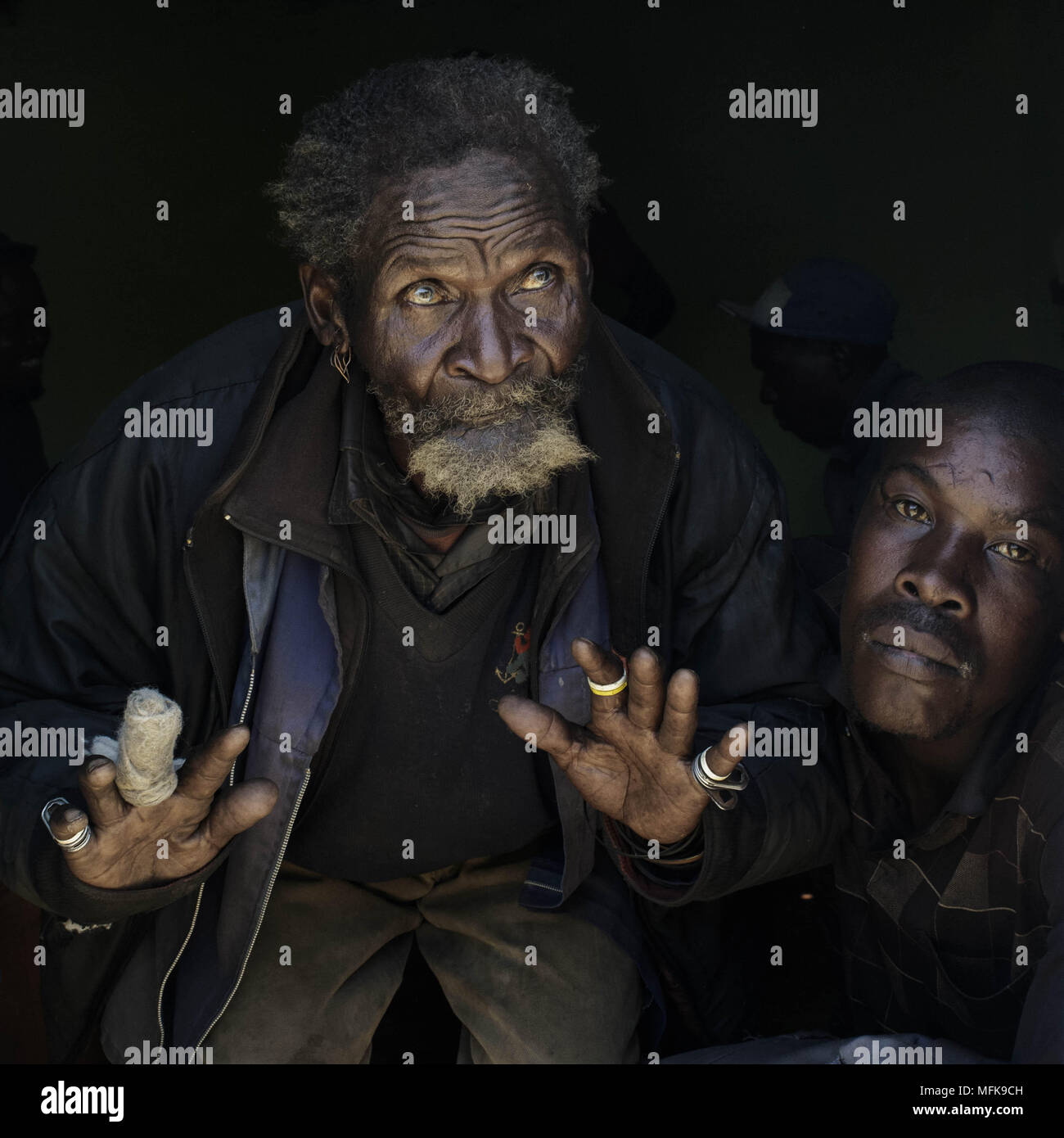 December 8, 2017 - Matatiele, Eastern Cape, South Africa - Malign, 87, attends an initiation ceremony. He worked his entire life underground, digging for gold in the mines of Johannesburg. Next to him is Bulelani, 29, an ex convict. They are friends and support each other. (Credit Image: © Stefan Kleinowitz via ZUMA Wire) Stock Photo
