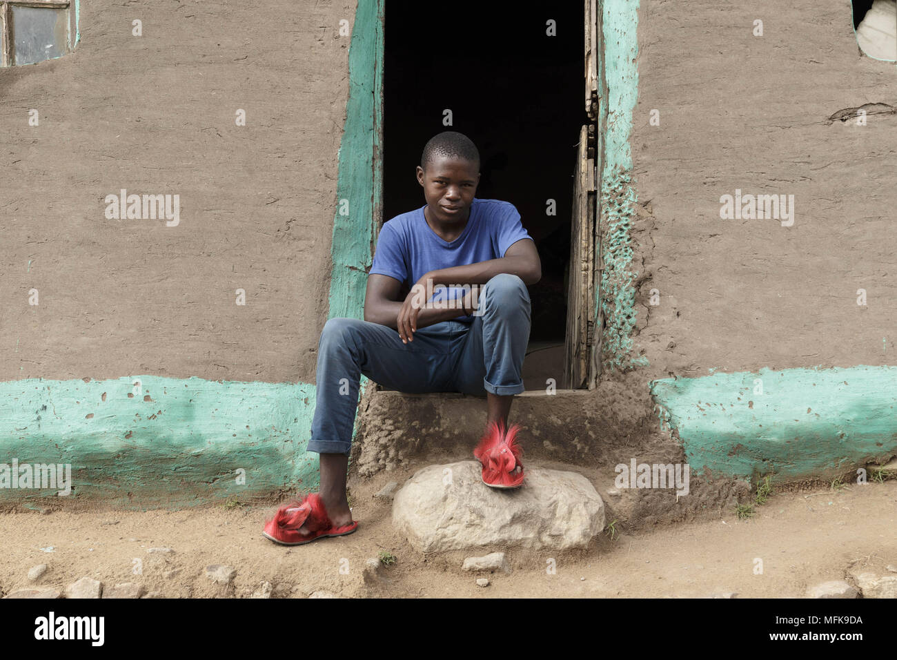 January 13, 2018 - Matatiele, Eastern Cape, South Africa - Thebo, 20, sits in front of his mud house. He dropped out of school and sells cannabis. He says: 'My friends who finished school are all without a job, or they have left to Johannesburg' (Credit Image: © Stefan Kleinowitz via ZUMA Wire) Stock Photo