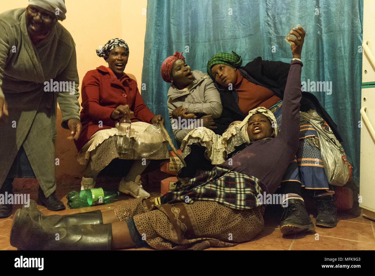 December 6, 2017 - Matatiele, Eastern Cape, South Africa - Xhosa women and mothers of initiates drink a lot of alcohol to celebrate their son's transition into manhood. Tomorrow their 'children' will return from the mountains and reunite with their families and communities as respected men. (Credit Image: © Stefan Kleinowitz via ZUMA Wire) Stock Photo