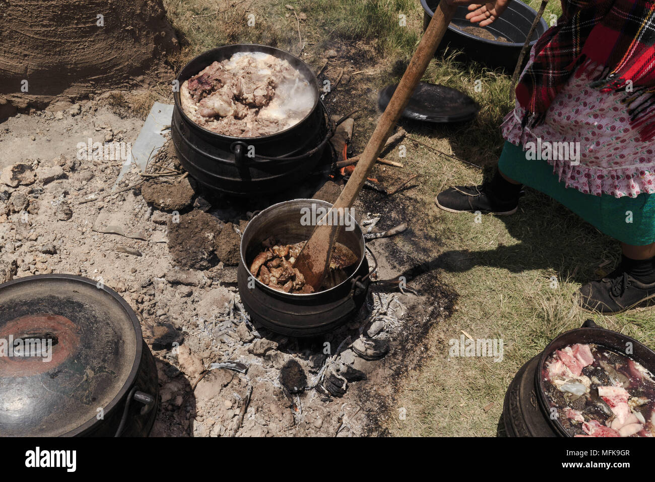 December 2, 2017 - Matatiele, Eastern Cape, South Africa - A Xhosa women prepares meat for an initiation ceremony at an open fire place. (Credit Image: © Stefan Kleinowitz via ZUMA Wire) Stock Photo