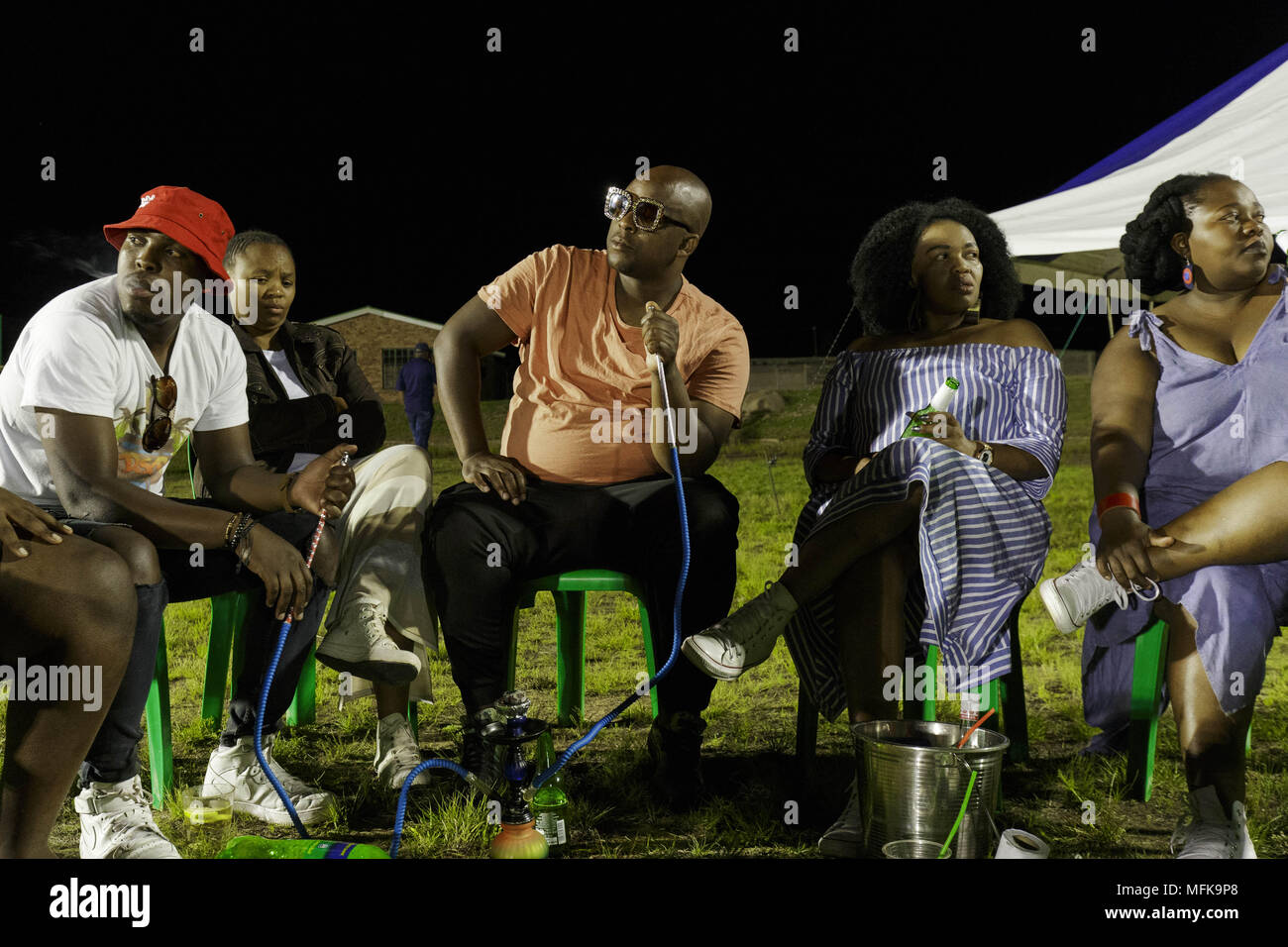 Matatiele, Eastern Cape, South Africa. 24th Dec, 2017. Xhosa men and women attend a party, smoke shisha and drink beer. Credit: Stefan Kleinowitz/ZUMA Wire/Alamy Live News Stock Photo