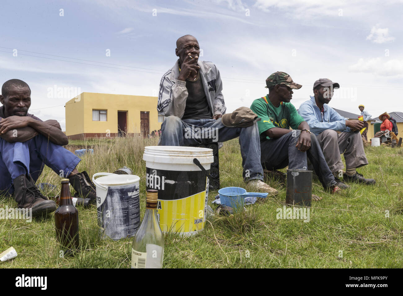 Matatiele, Eastern Cape, South Africa. 2nd Dec, 2017. Xhosa men sit together and drink traditional home made beer. Credit: Stefan Kleinowitz/ZUMA Wire/Alamy Live News Stock Photo