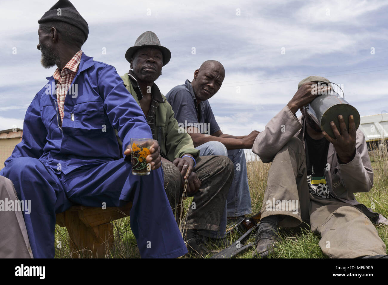 Matatiele, Eastern Cape, South Africa. 2nd Dec, 2017. Xhosa men sit together and drink traditional home made beer. Credit: Stefan Kleinowitz/ZUMA Wire/Alamy Live News Stock Photo