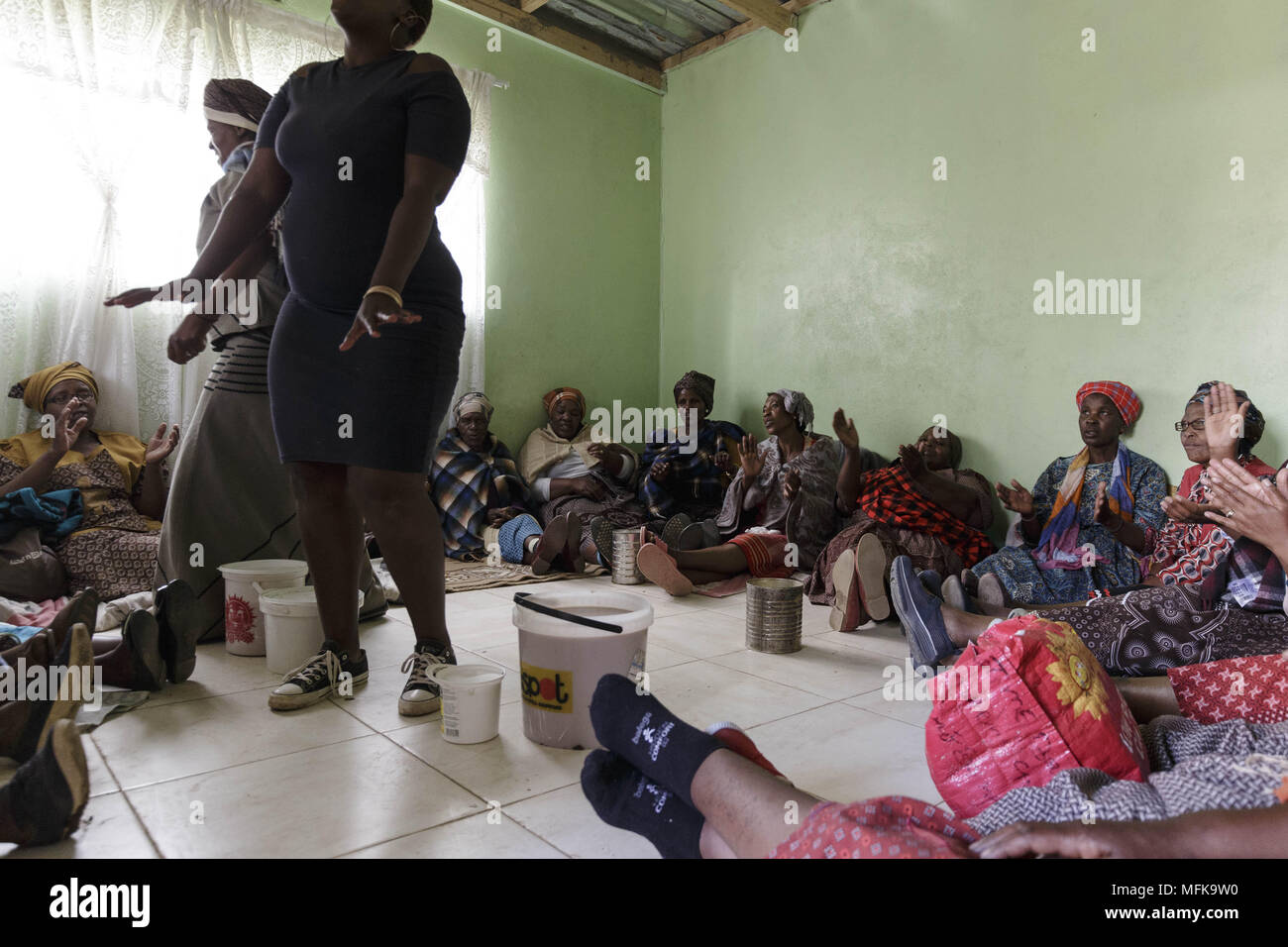 Matatiele, Eastern Cape, South Africa. 27th Dec, 2017. Xhosa women sit together and drink a lot of traditional home made beer to celebrate the initiation of their sons. Credit: Stefan Kleinowitz/ZUMA Wire/Alamy Live News Stock Photo