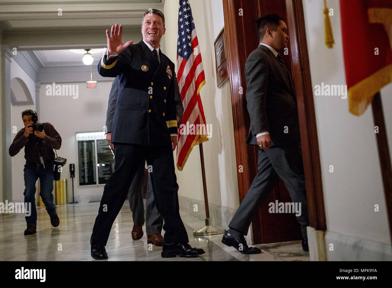 Washington, USA. 16th Apr, 2018. Veterans Affairs Secretary nominee Ronny Jackson (L, front) is seen on Capitol Hill in Washington, DC, the United States, on April 16, 2018. White House physician Ronny Jackson announced on April 26 that he had withdrawn from President Donald Trump's nomination to be the next Veterans Affairs Secretary, in the wake of a series of allegations that he had fostered a hostile work environment and behaved improperly while serving as the top doctor in the White House. Credit: Ting Shen/Xinhua/Alamy Live News Stock Photo