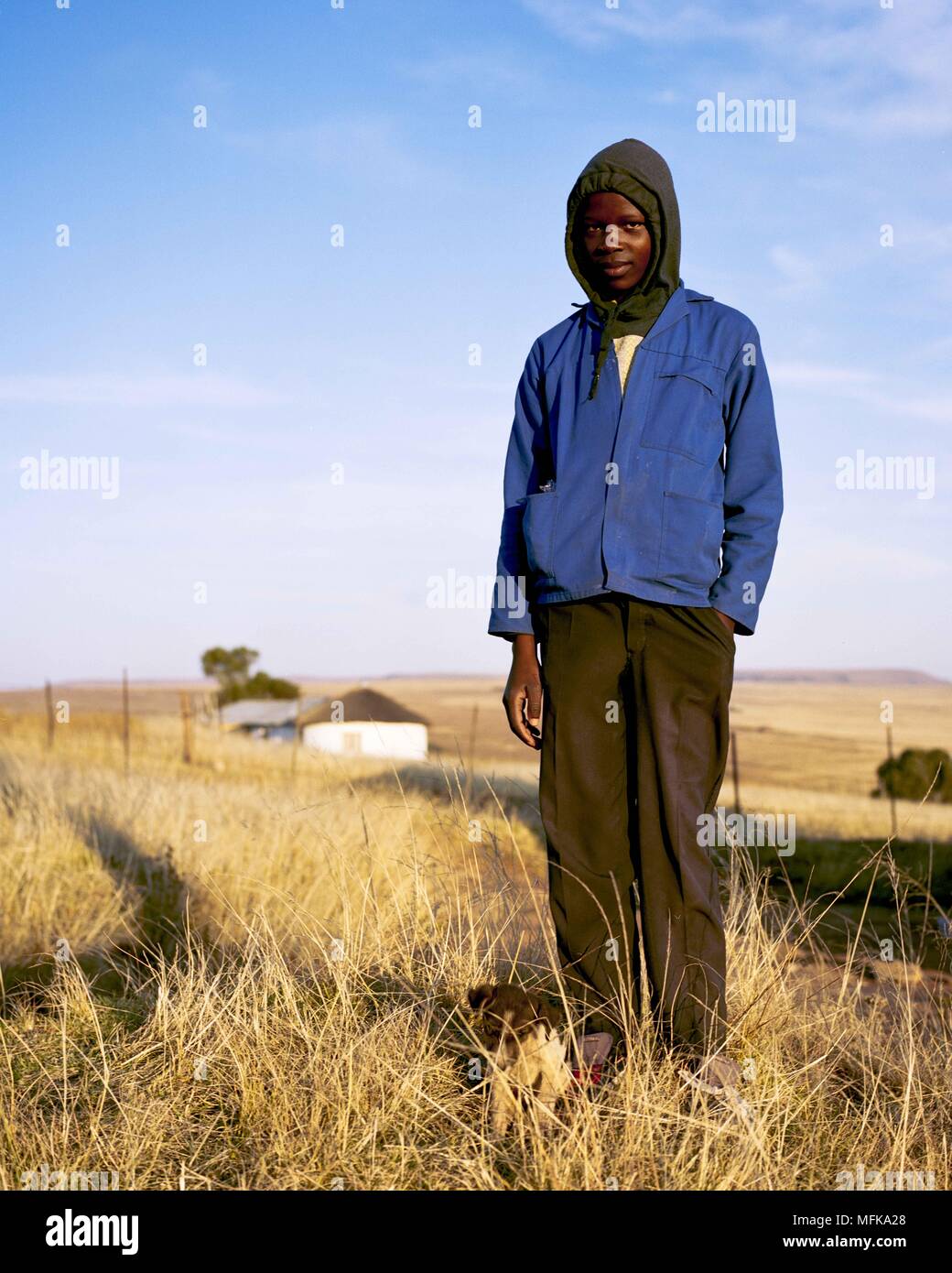 Matatiele, Eastern Cape, South Africa. 11th Jan, 2018. Thabo, 14, is dressed in a blue jacket, which is also the typical uniform of a Xhosa man. Credit: Stefan Kleinowitz/ZUMA Wire/Alamy Live News Stock Photo