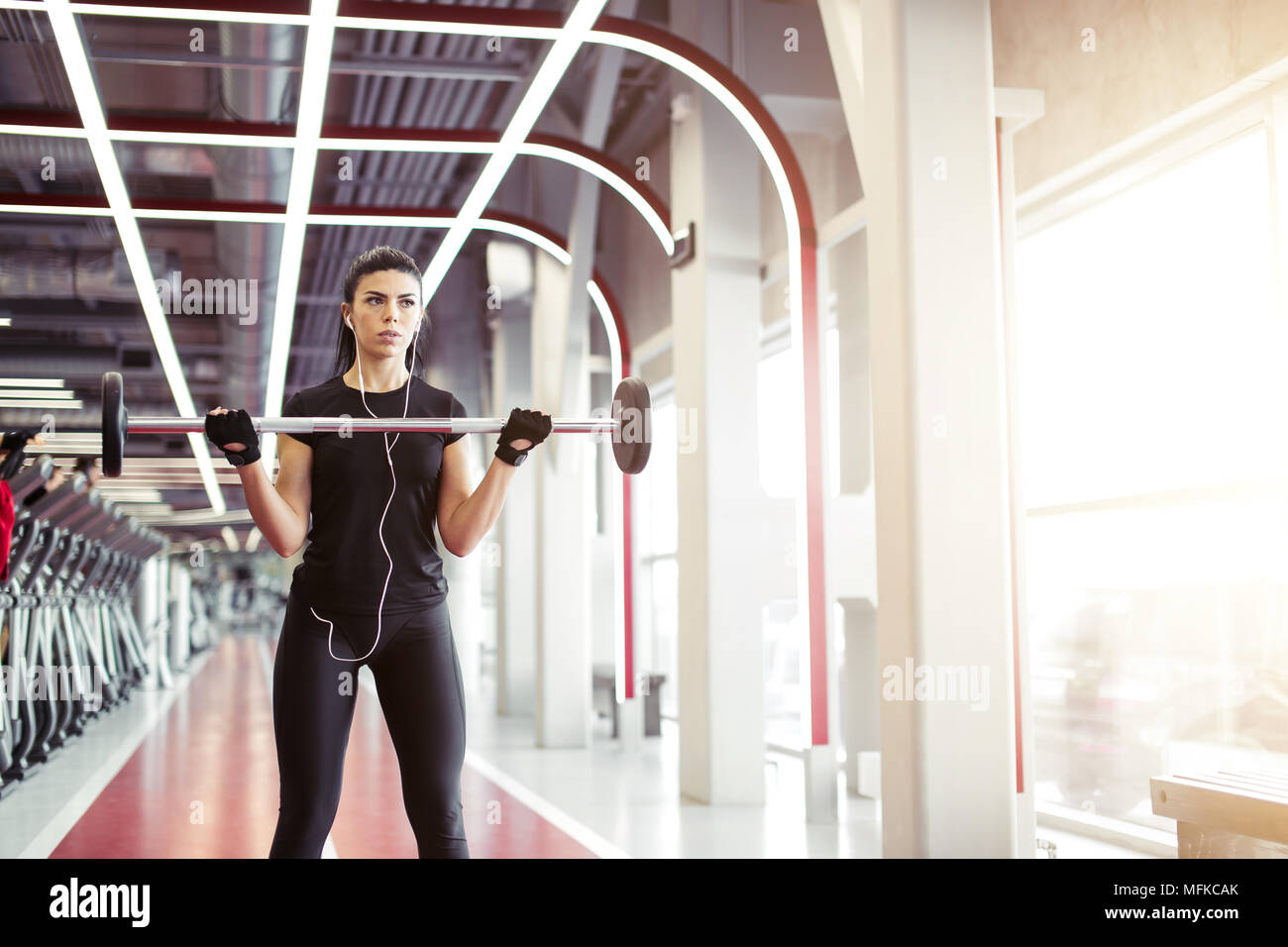 young fitness woman exercise with barbells in gym for building muscles Stock Photo Alamy