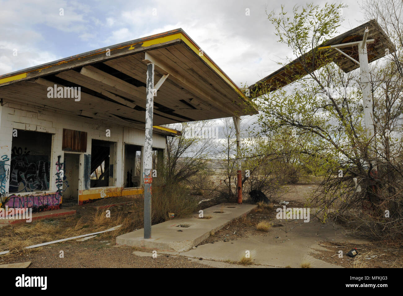 Ruins of a former Whiting Brothers gas station with a collapsing sign along old Route 66 west of San Fidel, New Mexico. Stock Photo