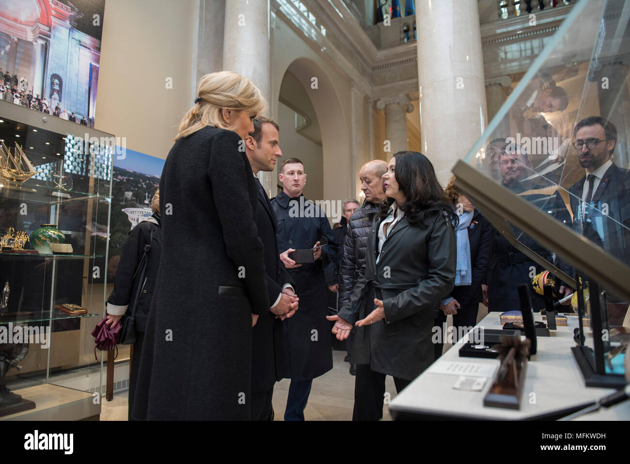 Karen Durham-Aguilera (right), executive director, Army National Military Cemeteries, speaks with French President Emmanuel Macron (center) with his wife, Brigitte Macron (left), after receiving a tour from of the Memorial Amphitheater Display Room at Arlington National Cemetery, Arlington, Virginia, April 24, 2018.  Macron’s visit to Arlington National Cemetery was part of the first official State Visit from France since President Francois Hollande came to Washington in 2014. The French President along with his wife also visited the gravesite of former President John F. Kennedy. (U.S. Army ph Stock Photo