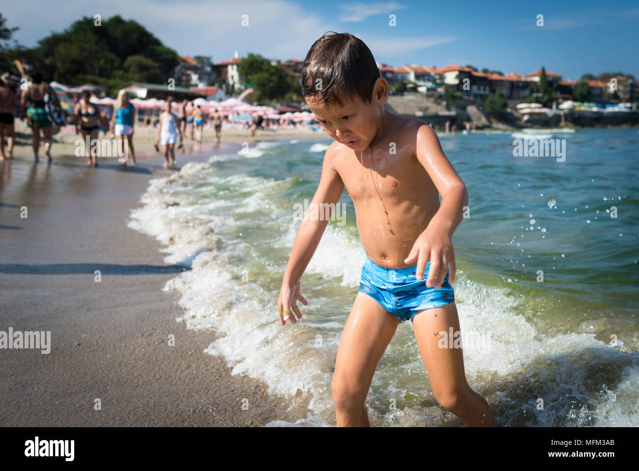 Funny little boy comes out from the sea like a zombie. Small child playing on the beach near water in sunny warm day Stock Photo - Alamy Funny little boy comes out from the sea like a zombie. Small child playing on the beach near water in sunny warm day Stock Photo - Alamy