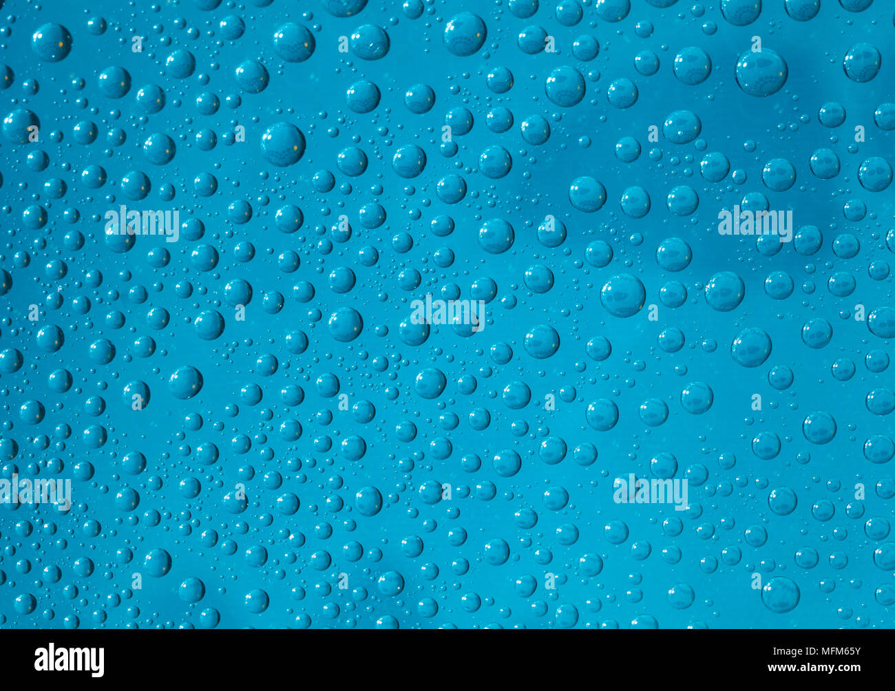 water drops on a glass surface blue Stock Photo