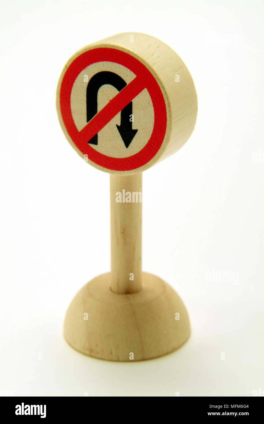 A side view of a simple wooden toy road sign directing traffic that is No U-Turn ahead.  Bandphoto / COMPULSORY CREDIT: Hotshoe/Photoshot & Agency pho Stock Photo