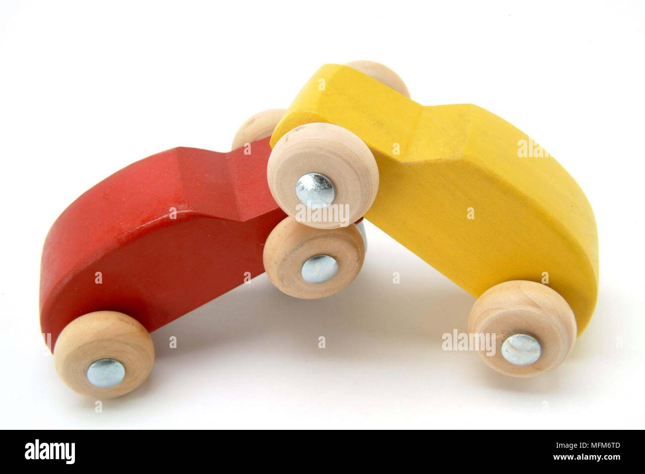 Two small wooden toy cars red and yellow, have had a head-on crash. Illustrating a traffic accident.    Bandphoto / COMPULSORY CREDIT: Hotshoe/Photosh Stock Photo