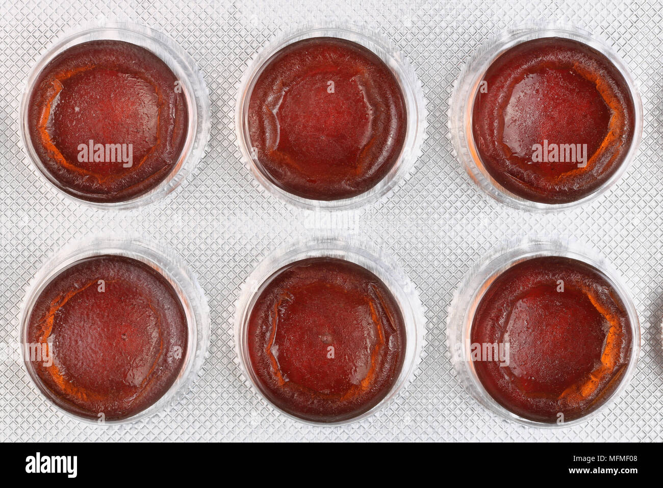 Six red tablets to increase hemoglobin in the blood are packed in white  plastic. Top view studio macro shot Stock Photo - Alamy
