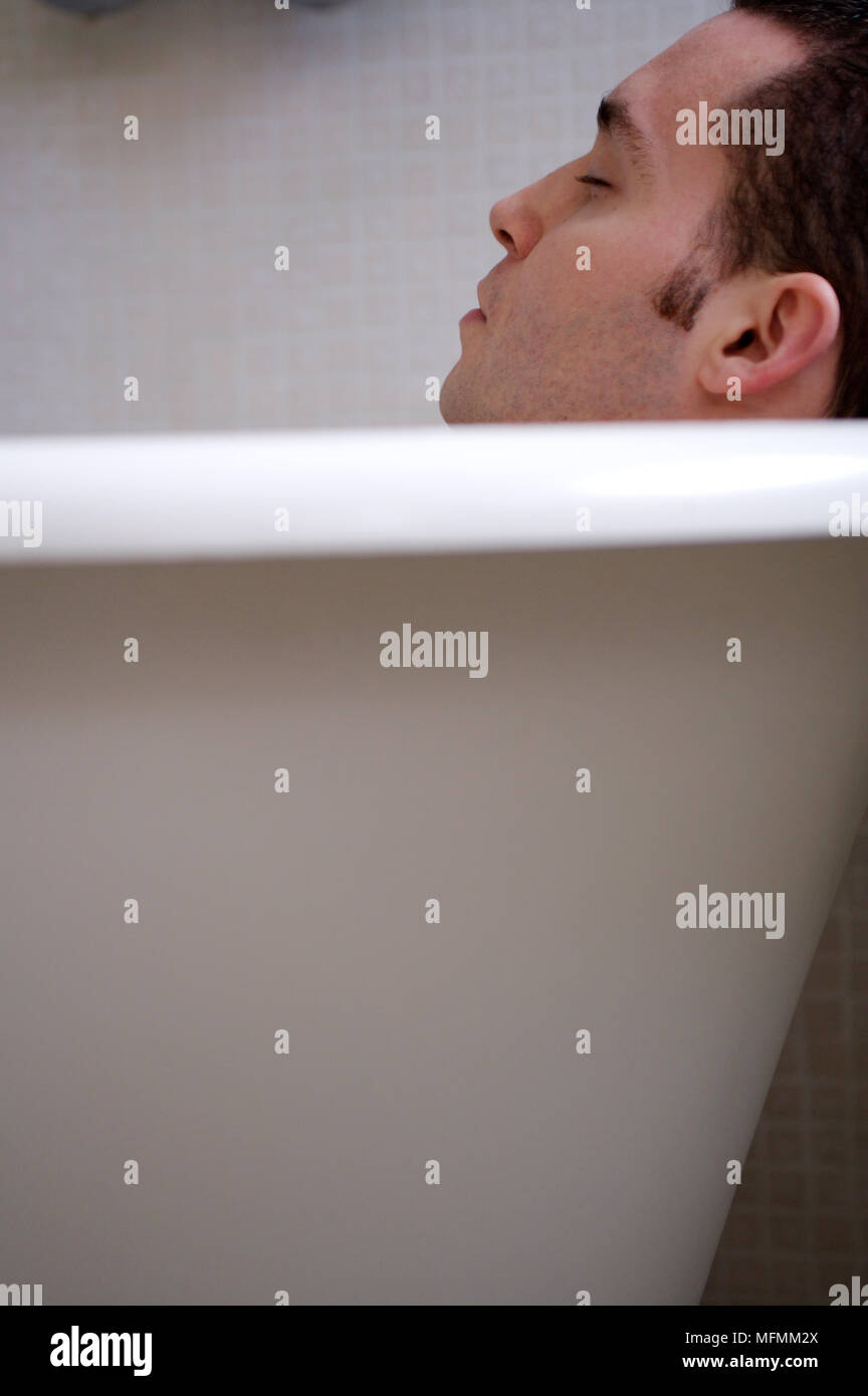 Man sleeping in bathtub hires stock photography and images Alamy