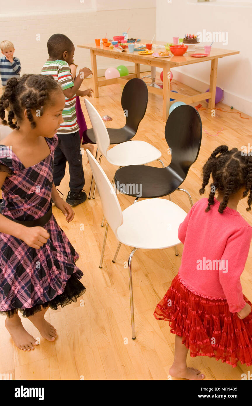 Group of children playing musical chairs Ref Compulsory Credit Stock Photo Alamy