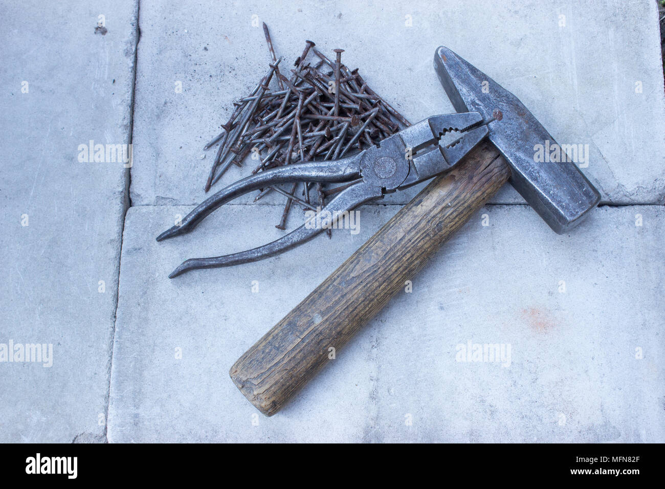 Old rusty tools must be replaced with new ones. Stock Photo