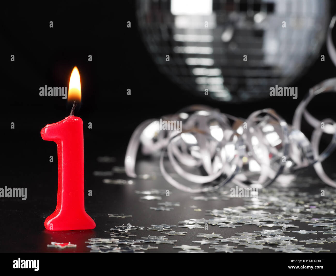 Red candles showing Nr. 1  Abstract Background for birthday or anniversary party. Stock Photo