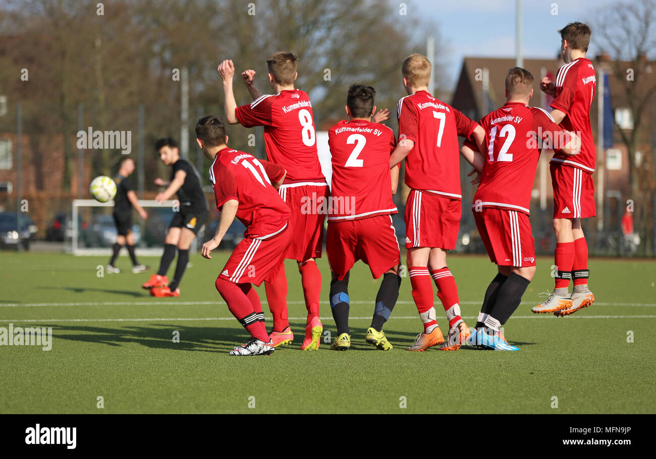 Football-players forming a wall Stock Photo