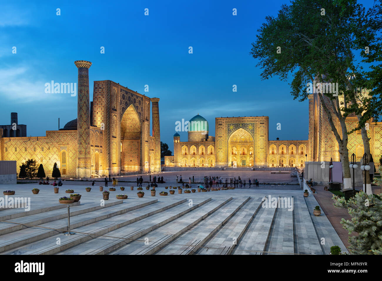 Registan square at dusk - the ancient center of Samarkand, Uzbekistan Stock Photo