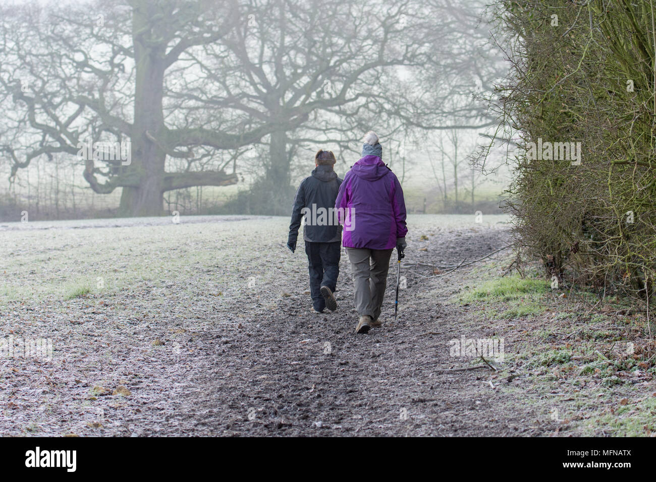 Walkers heading out from Mickleton on a Cotswold walk on a frosty morning Stock Photo