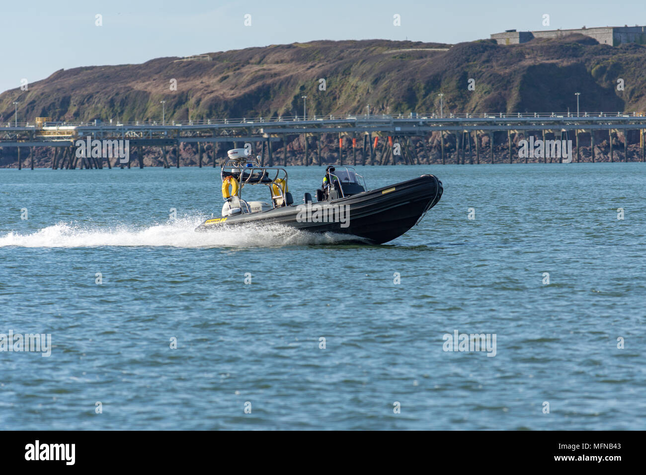 Police patrolling Milford Haven in a fast rib Stock Photo