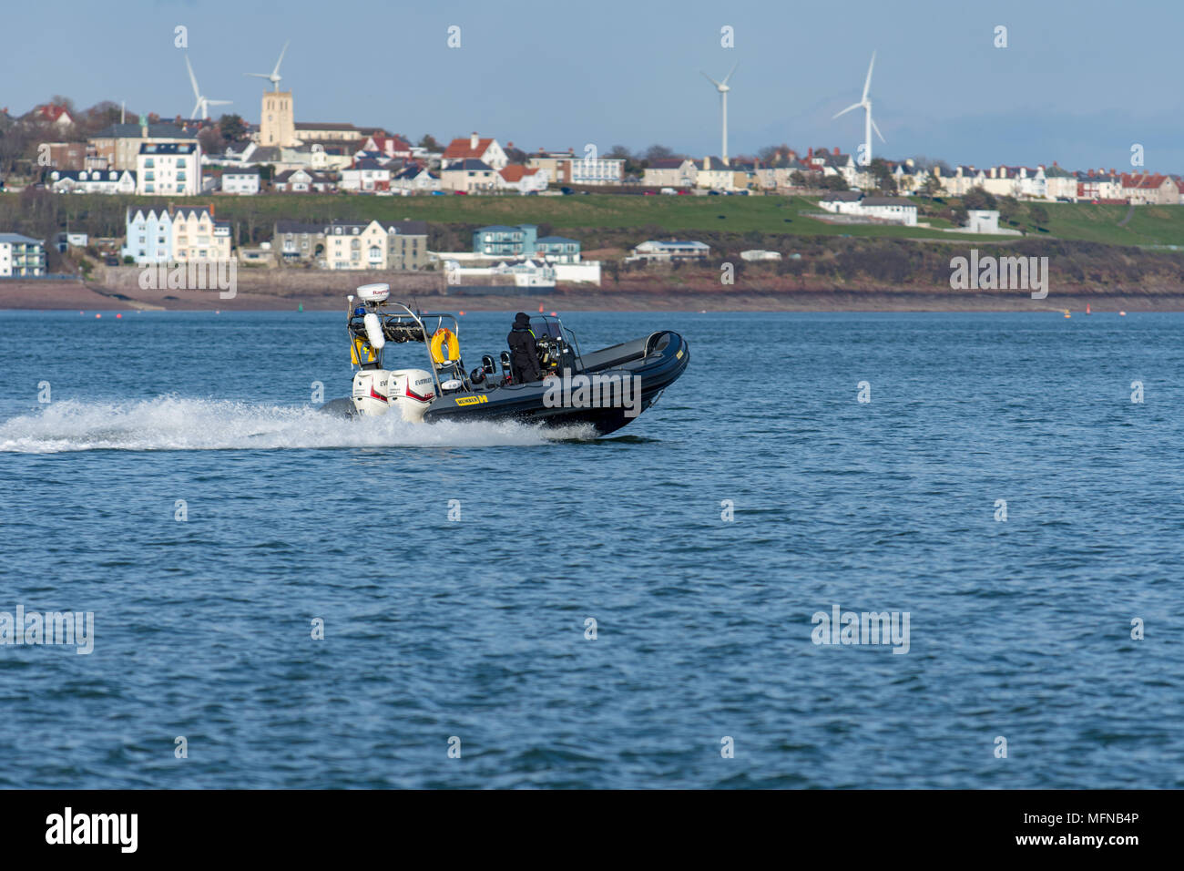 Police patrolling Milford Haven in a fast rib Stock Photo