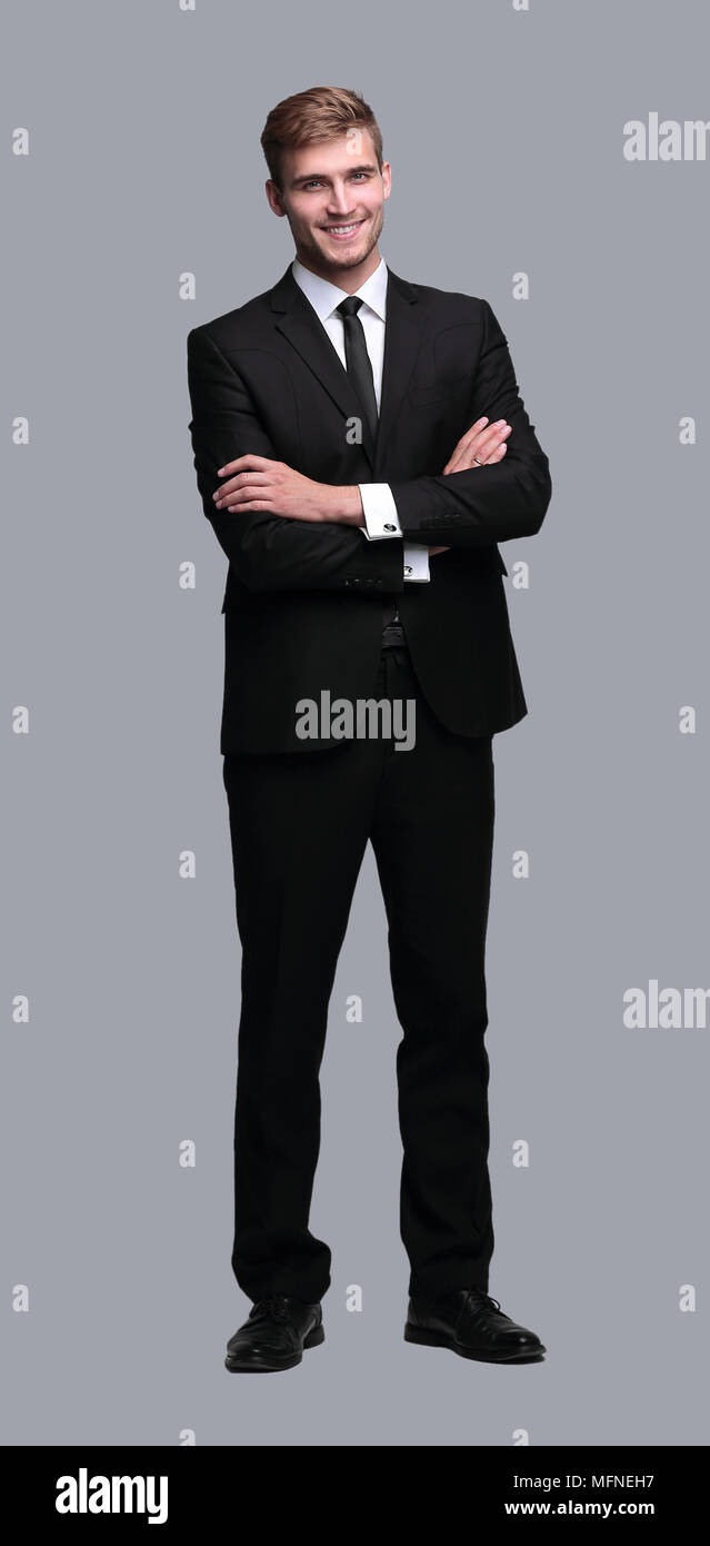 portrait in full growth. successful businessman with arms crossed in ...