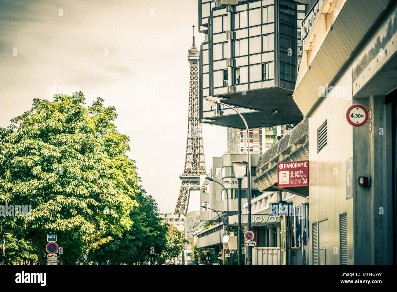 Paris, Eiffel Tower with trees and parking Stock Photo Alamy