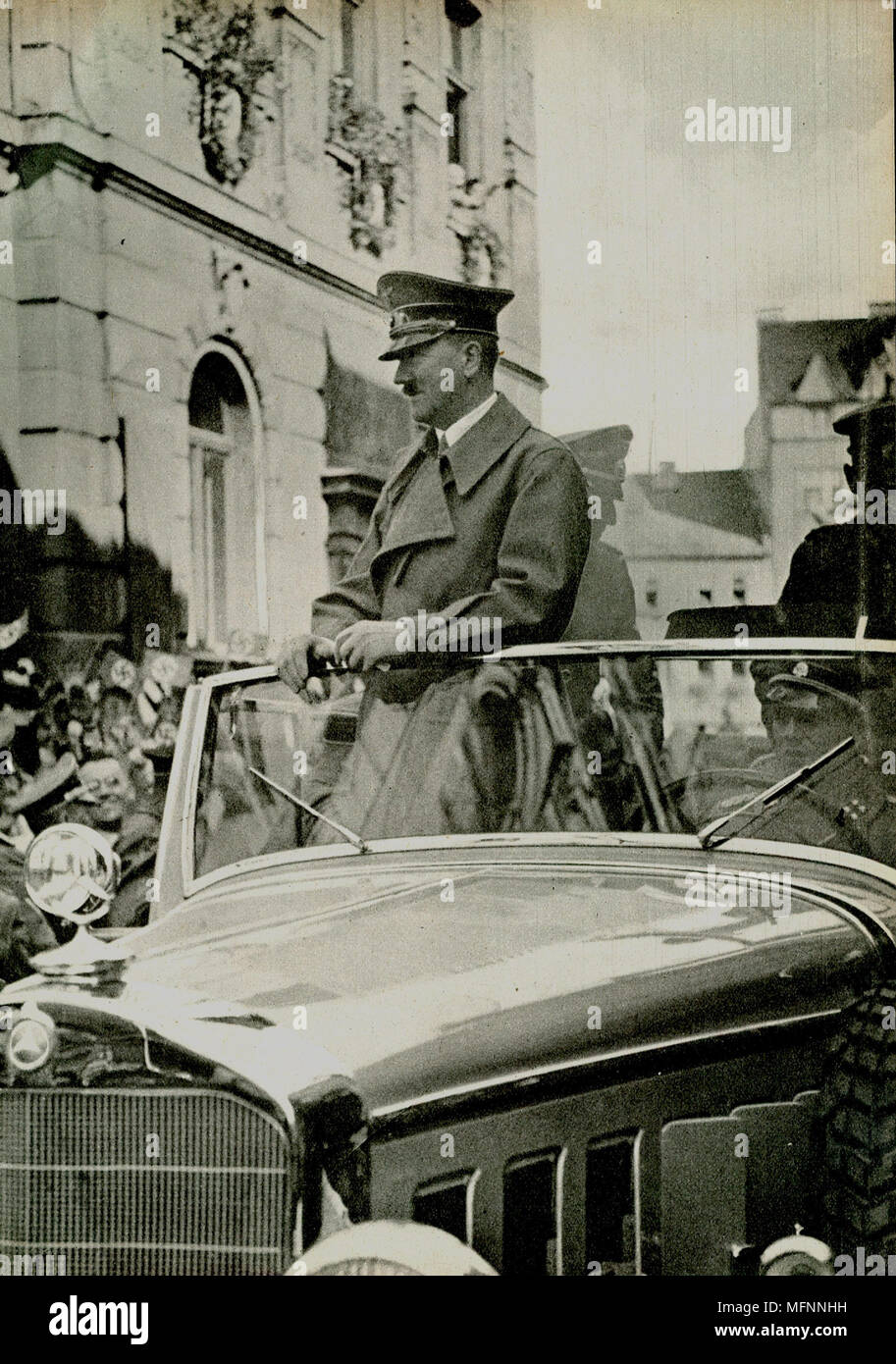 Adolf Hitler driven through a German city in an open Mercedes  c1936. Stock Photo