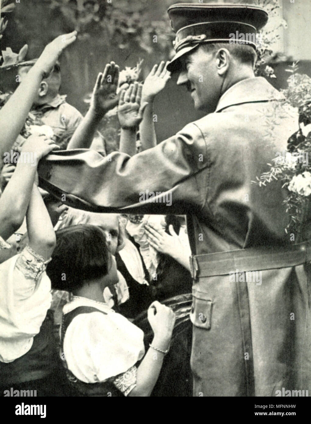 Adolf Hitler greets crowd during a visit to a German town, c1938. Stock Photo