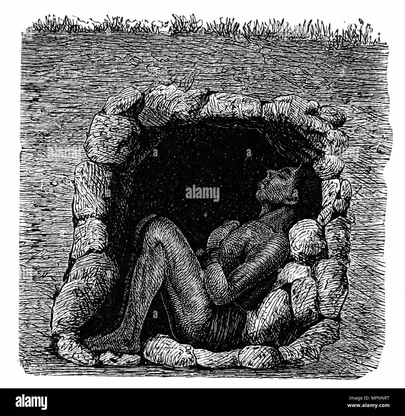 Burial: Grave of Zulu chief: body in sitting position in stone-lined underground chamber. Wood engraving from F Ratzel 'History of Mankind' Leipzig 1888. Wood engraving. Stock Photo