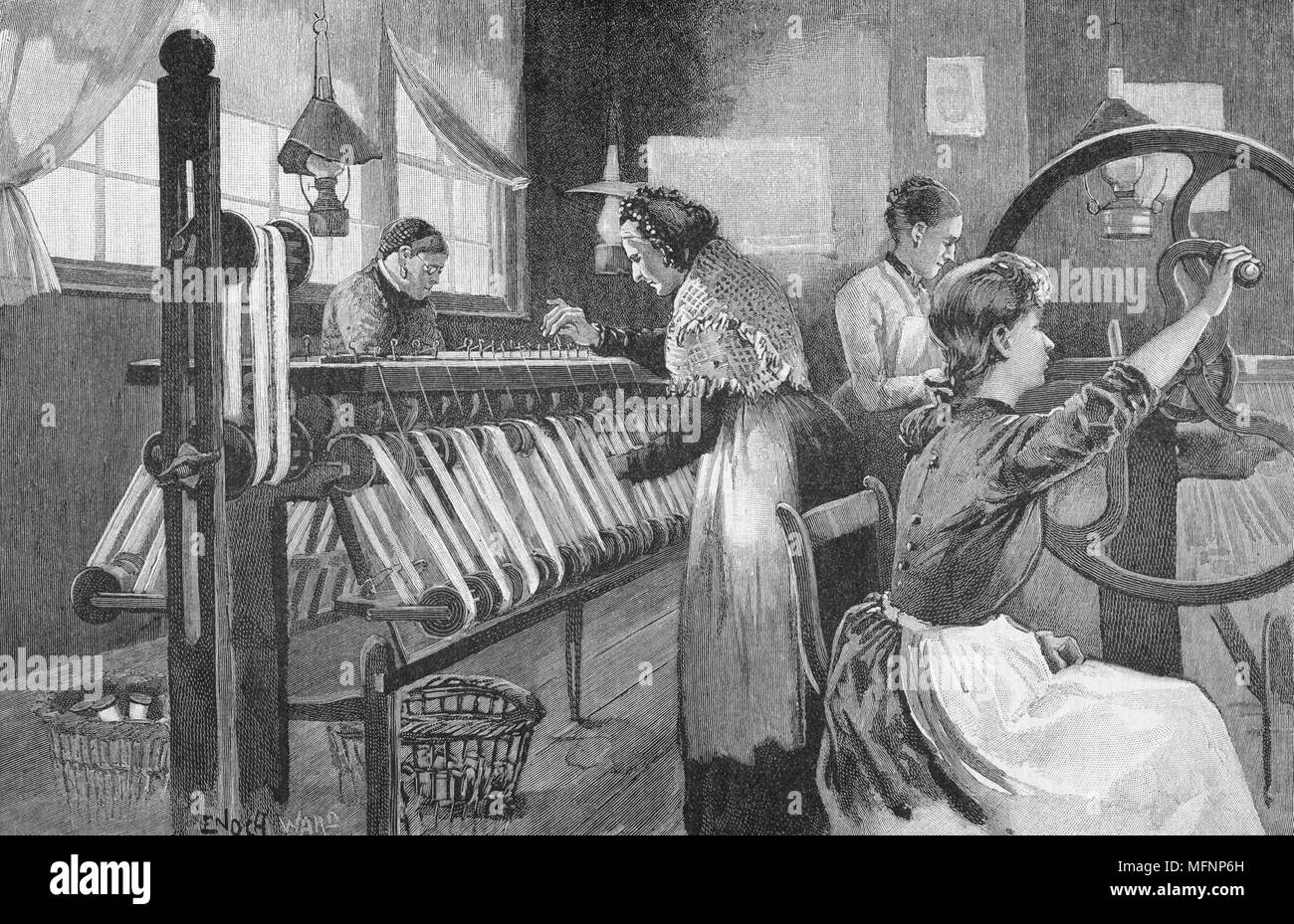 Spitalfields silk workers winding and reeling silk , London, England, late 19th century. This enclave of the silk industry was founded by Huguenot refugees from France after Louis XIV's Revocation of the Edict of Nantes (1685). Engraving, 1893. Stock Photo