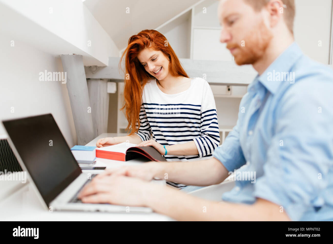 Colleagues working studying in white office Stock Photo