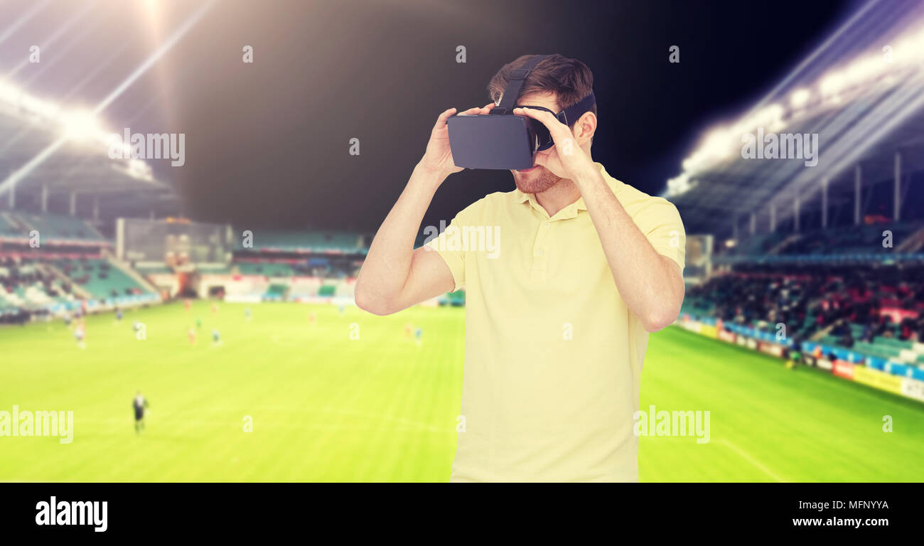 man in virtual reality headset over football field Stock Photo Alamy