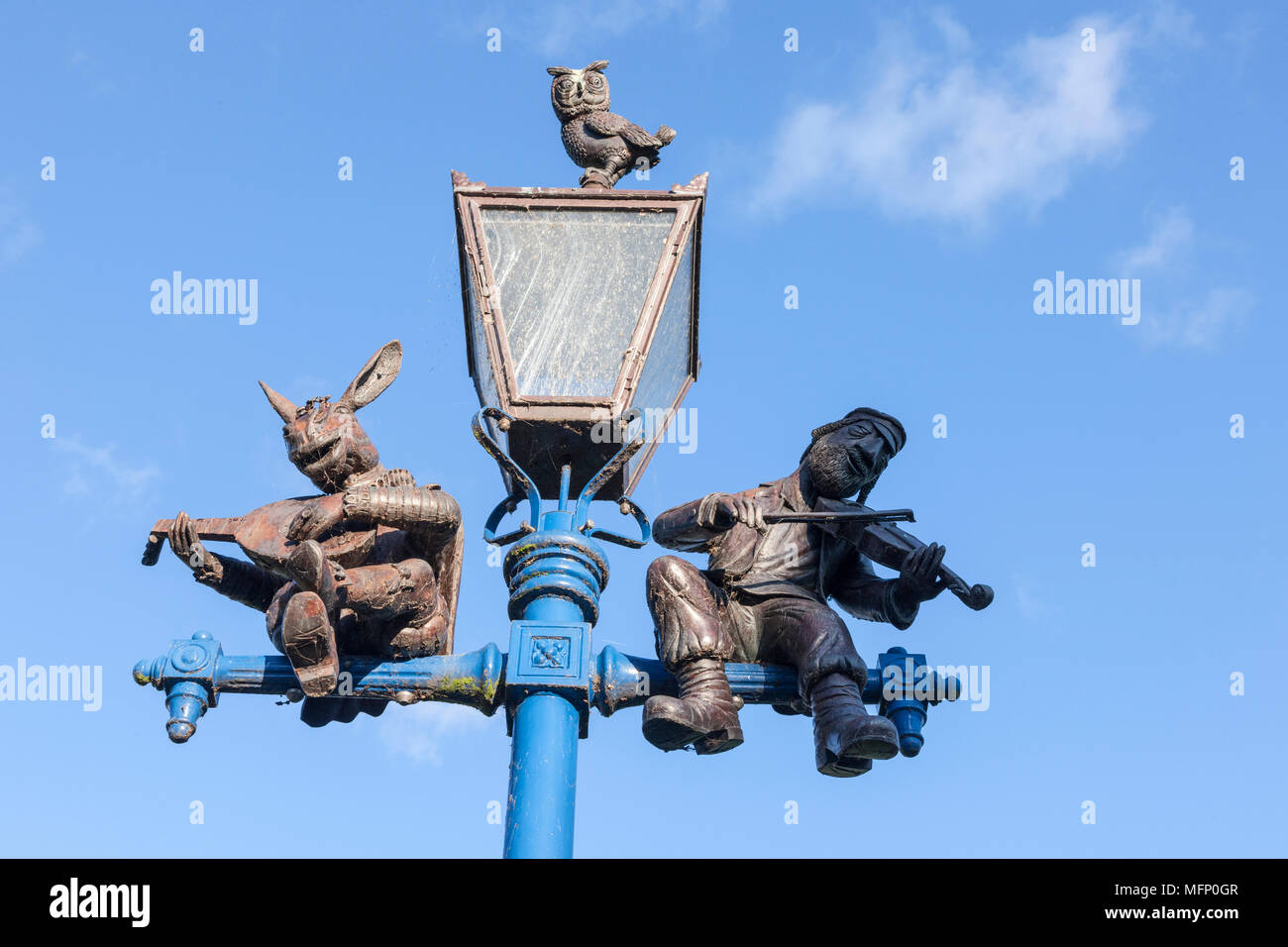 Ornate cast iron lamp post against a blue sky, Stratford upon Avon, Warwickshire, West Midlands, U.K. Stock Photo