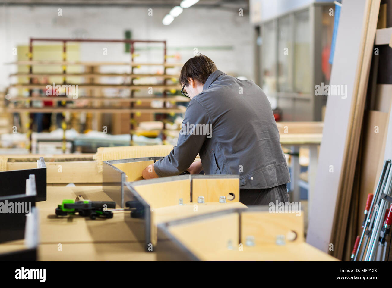 assembler making furniture factory workshop Stock Photo - Alamy