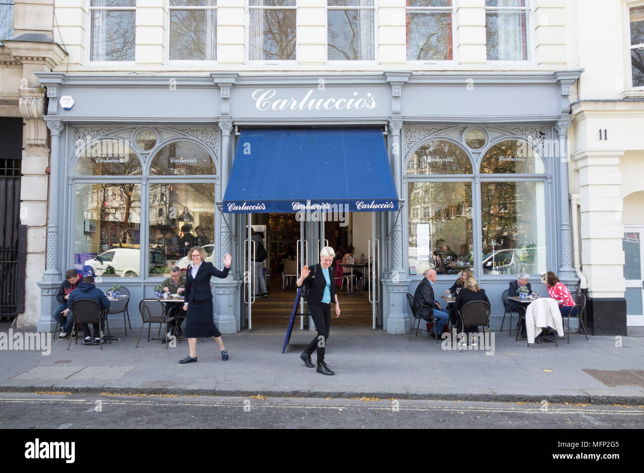 People eating outside Carluccio's Italian restaurant, West Smithfield, London, EC1, UK Stock Photo