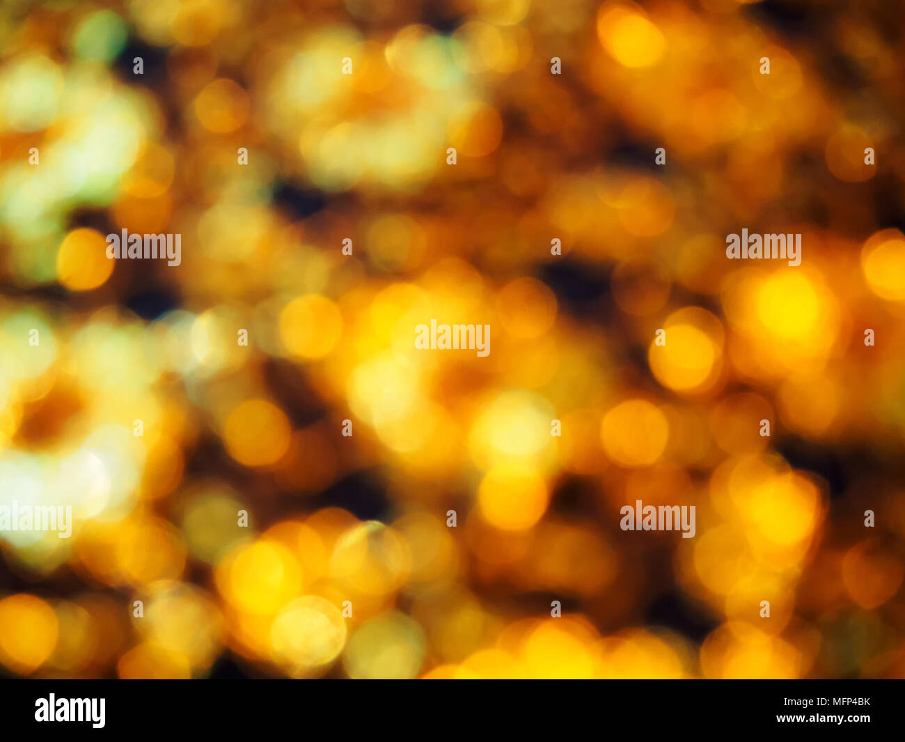 Abstract golden bokeh light on black background Stock Photo - Alamy