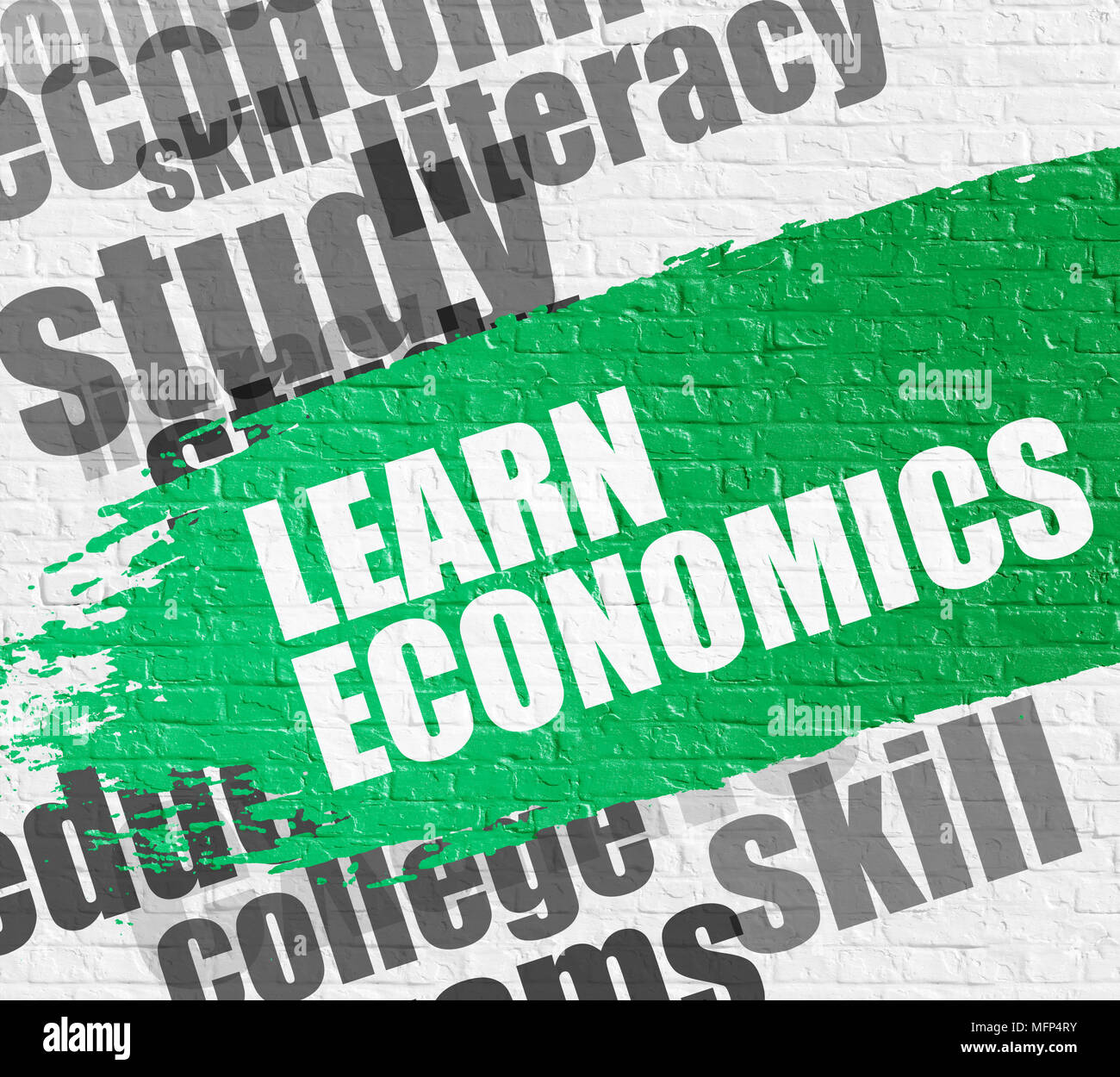 Learn Economics on White Brick Wall. Stock Photo