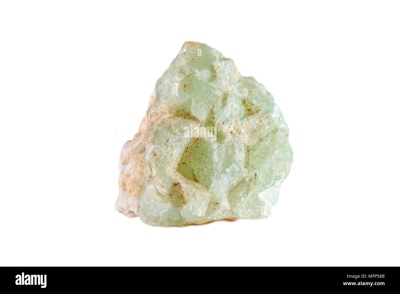 Macro shooting of natural gemstone. The raw mineral is prehnite. Isolated object on a white background. Stock Photo
