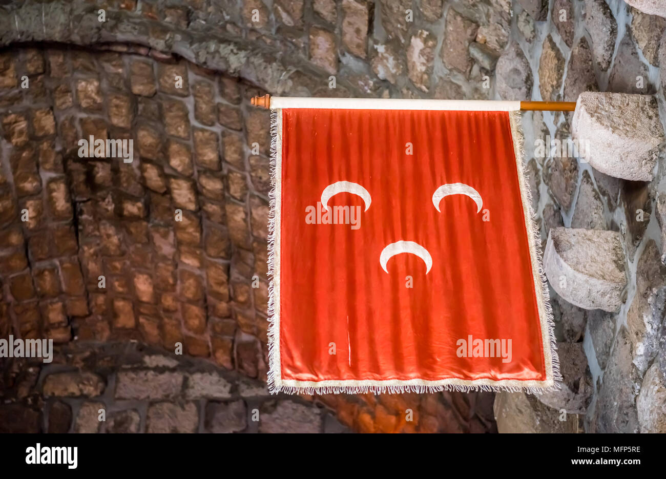 Islamic Ottoman Empire Flag hanging on wall of Castle of St. Pete or Bodrum Castle.Ottoman banners hanging in the English Tower Stock Photo