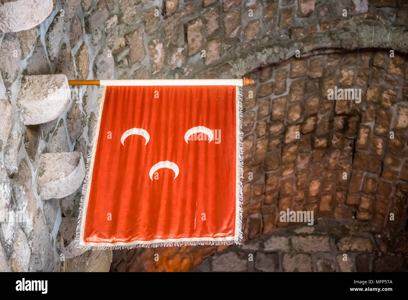 Islamic Ottoman Empire Flag hanging on wall of Castle of St. Pete or Bodrum Castle.Ottoman banners hanging in the English Tower Stock Photo