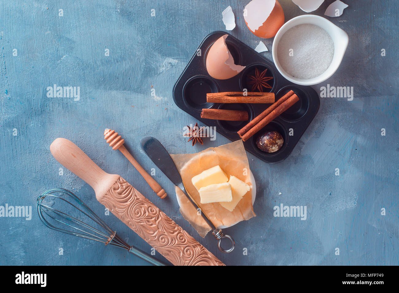 Baking tools and ingredients on a textured concrete background. Cooking utensils flat lay with copy space. Modern kitchen concept Stock Photo