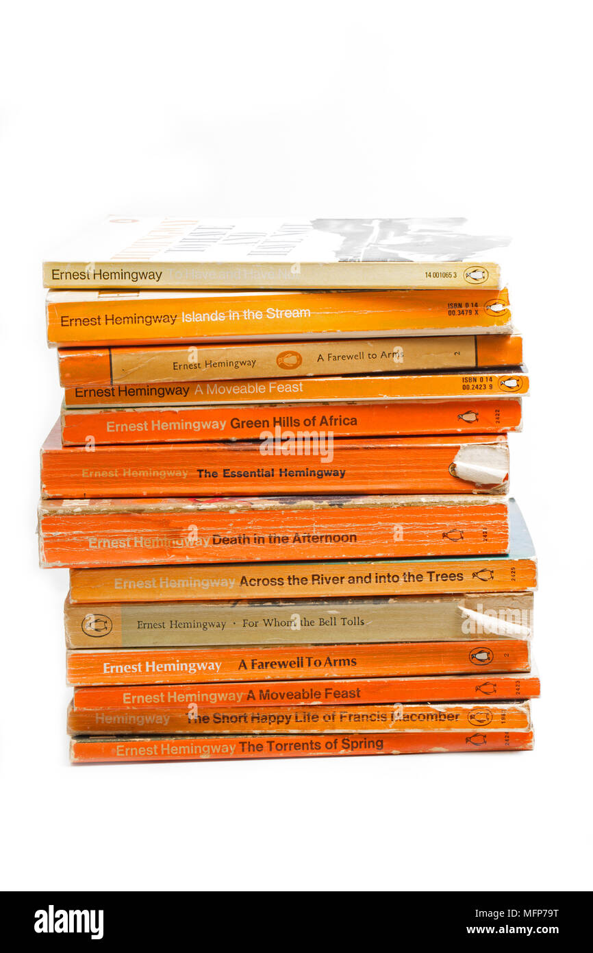 A collection of Penguin books with stories by Ernest Hemingway Stock Photo